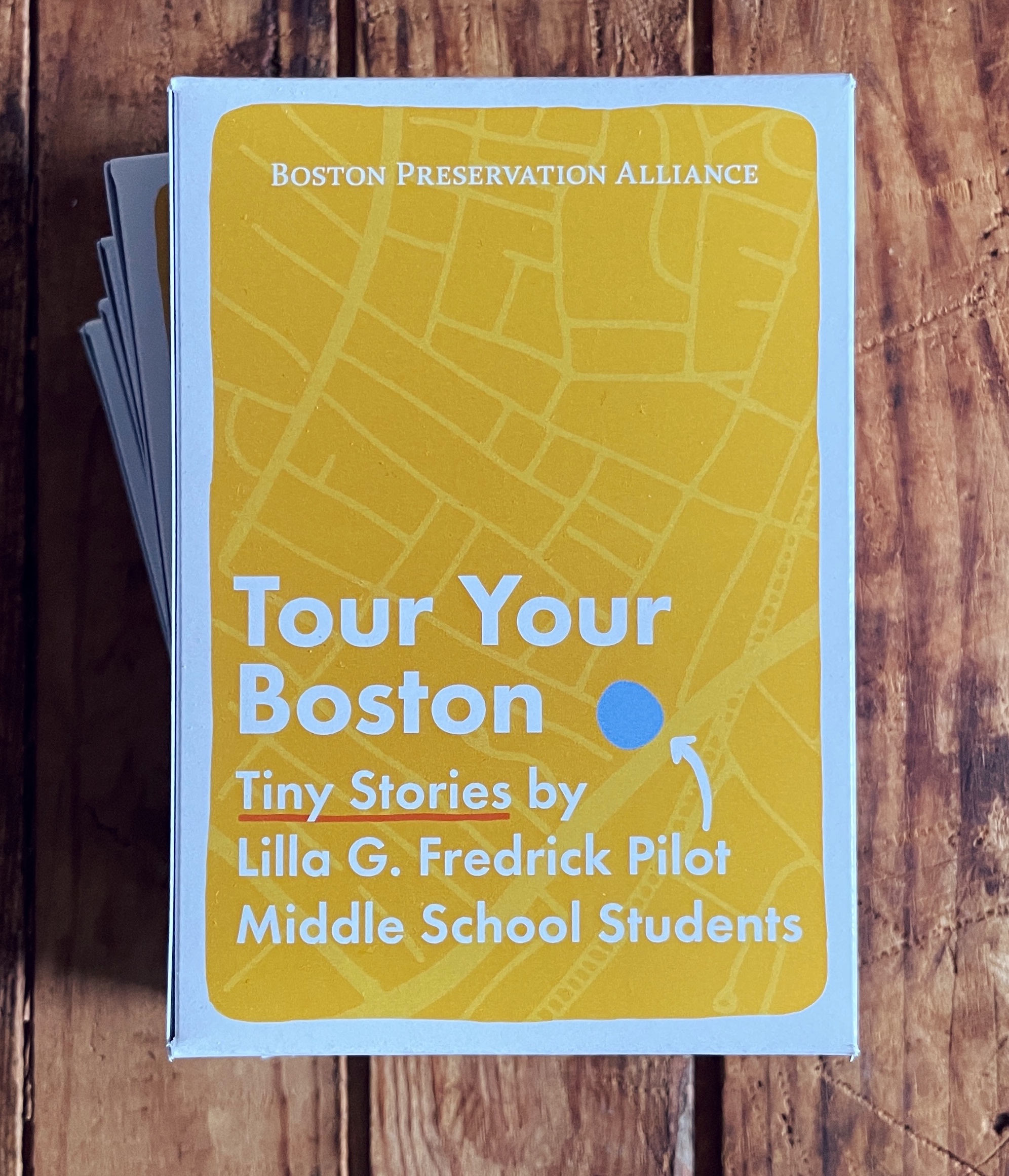 Tour Your Boston card set sitting on a table for display.