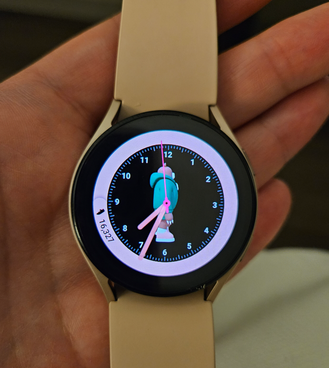 smart watch screen revealing 16,327 steps