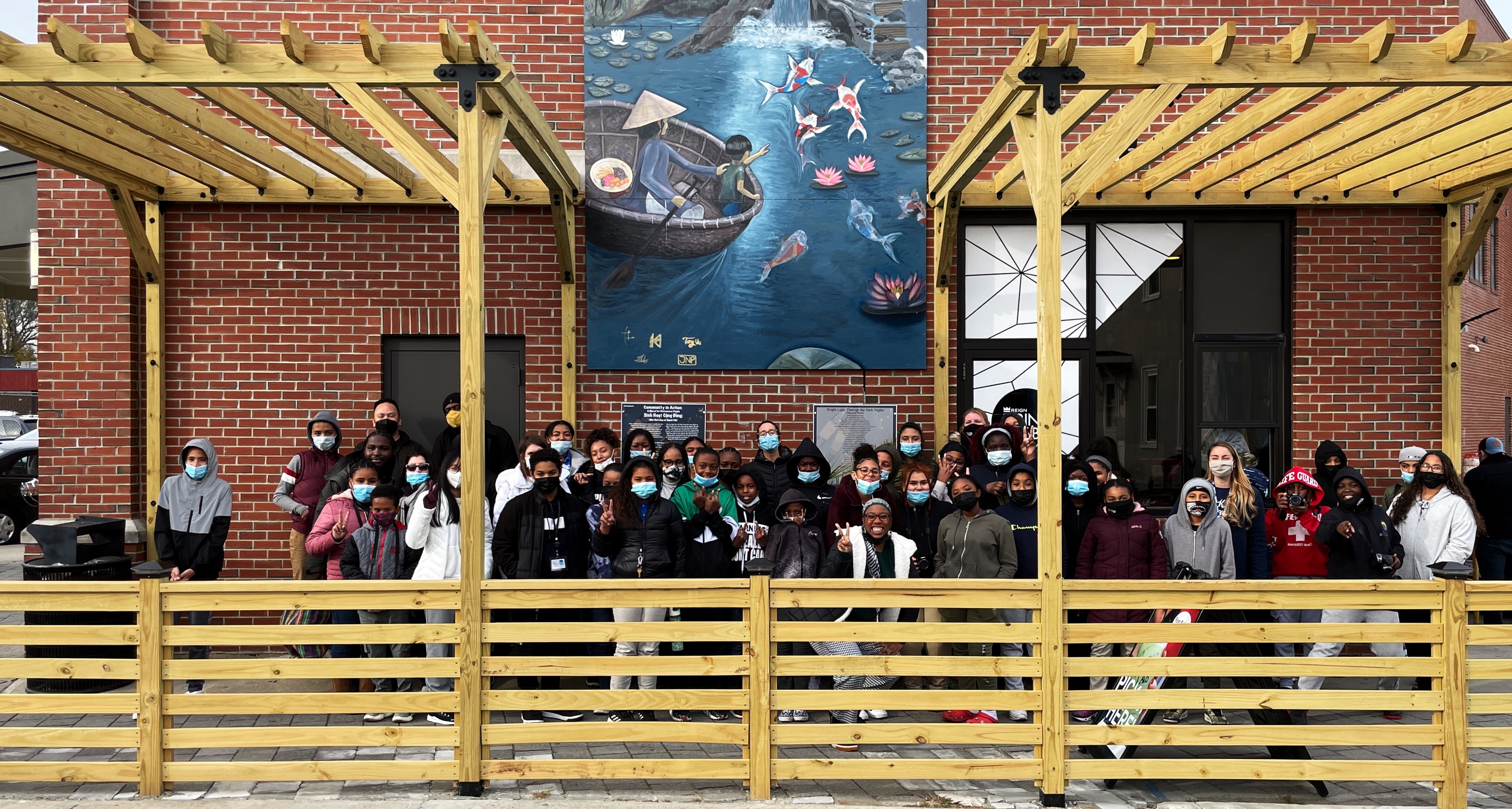 Boston Public School Students stand in front of Pho Hoa, a Vietnamese restaurant and legacy business in Dorchester, MA.